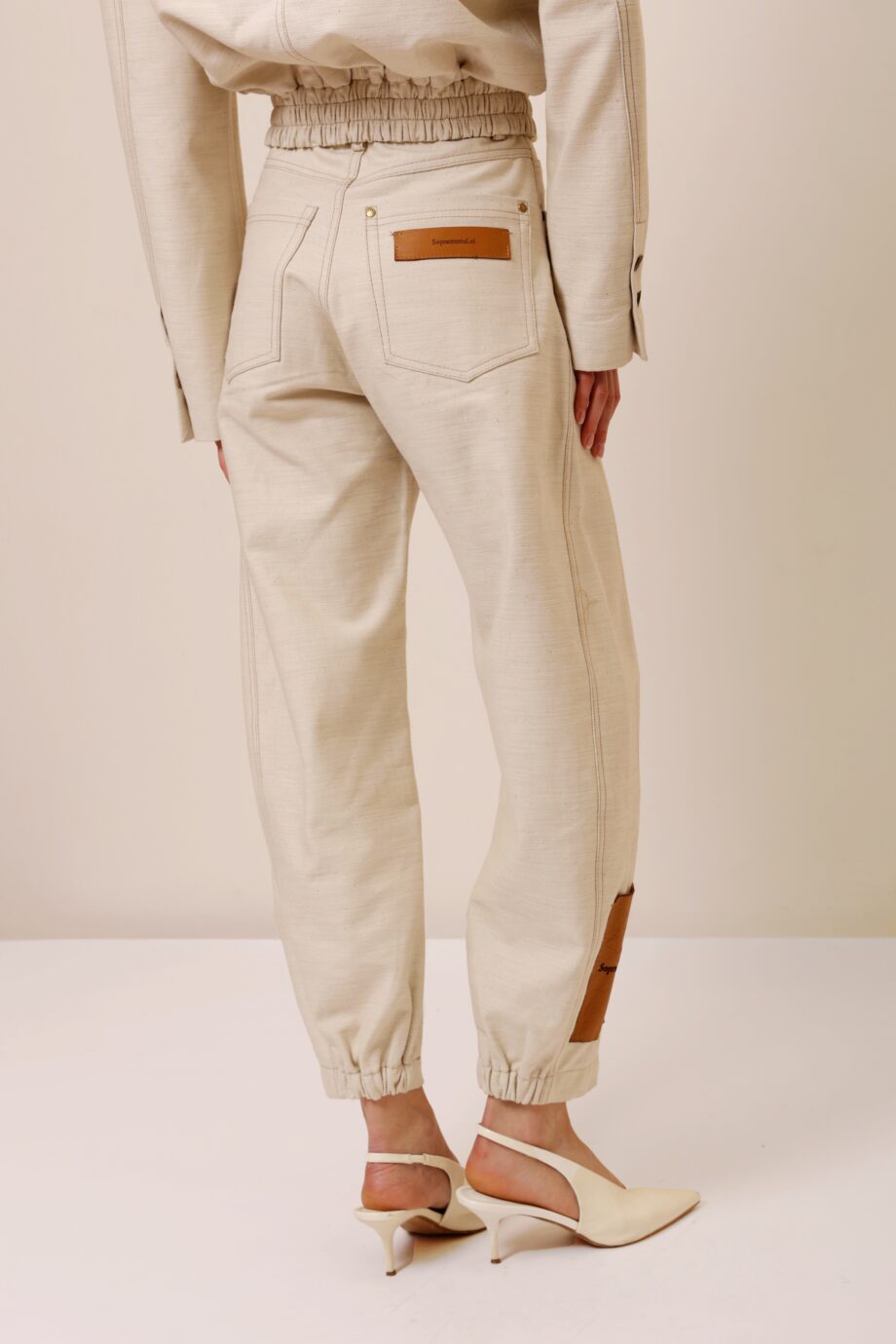 beige two piece set women back view