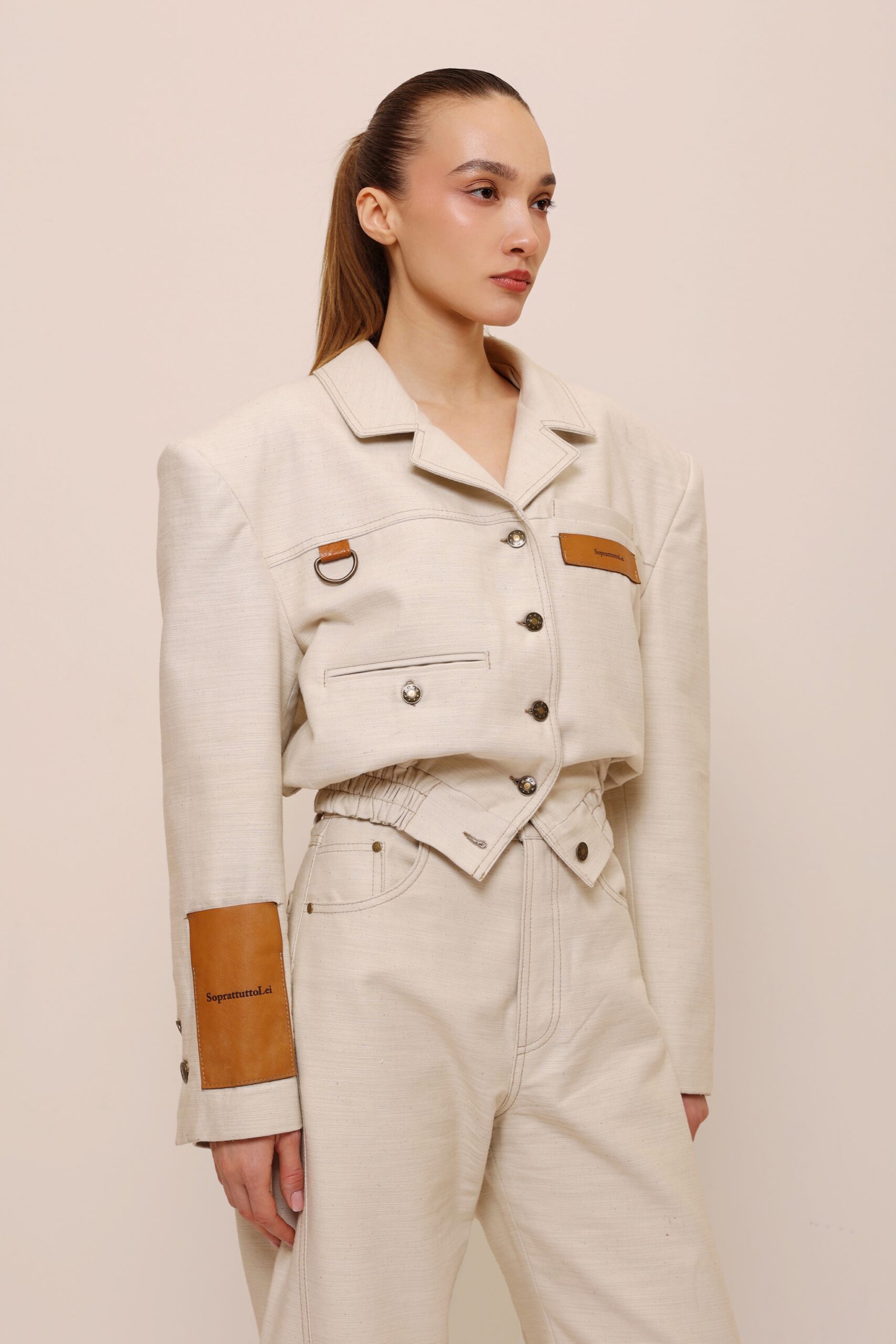 beige cropped jacket structured shoulders detail