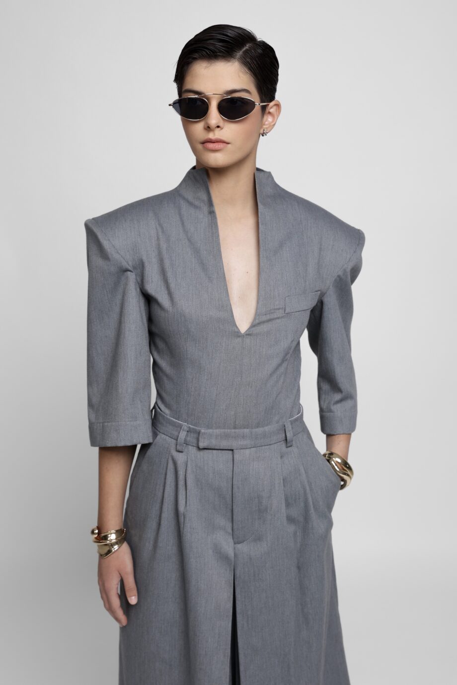 Grey fine wool two-piece set with structured V-neck top and pleated culottes