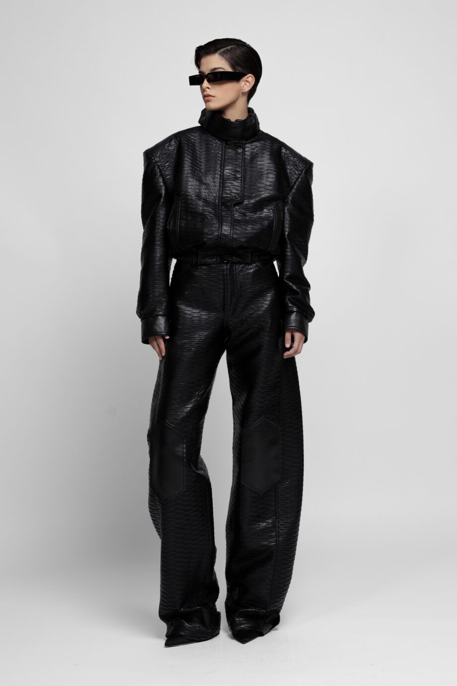 Black textured vegan leather jacket and wide-leg trousers set by SoprattuttoLei