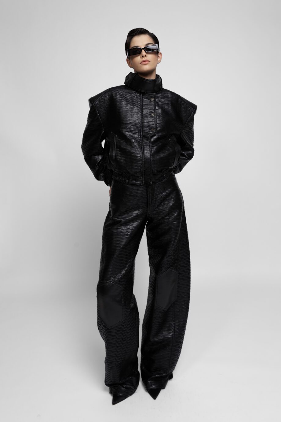 Black textured vegan leather jacket and wide-leg trousers set by SoprattuttoLei